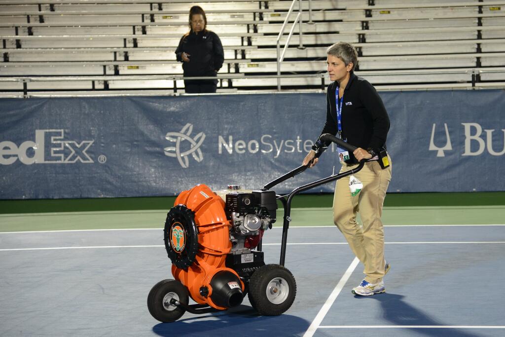 Marija Čičak pitches in to dry the court at the Citi Open. Photo by Christopher Levy of Tennis Grandstand.